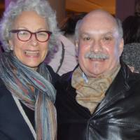 Two alumni pose together for a photo